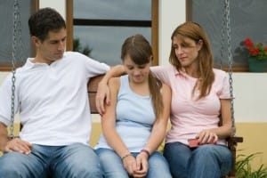 Parents talking with their teenager about pornography